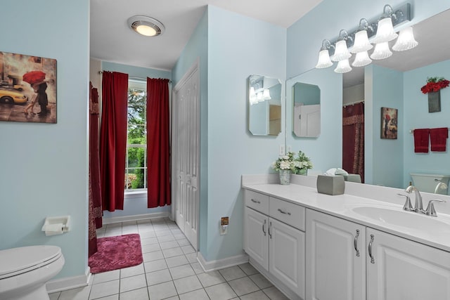 4004 Mclaughlin Dr, Tallahassee, FL 32309 - full bath with baseboards, tile patterned flooring, vanity, and toilet