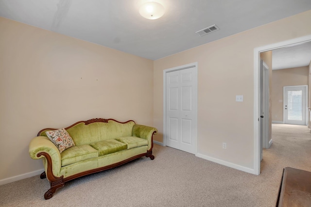 living area with light carpet