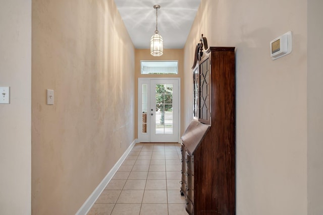 doorway with light tile patterned floors