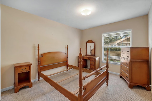 bedroom featuring light colored carpet