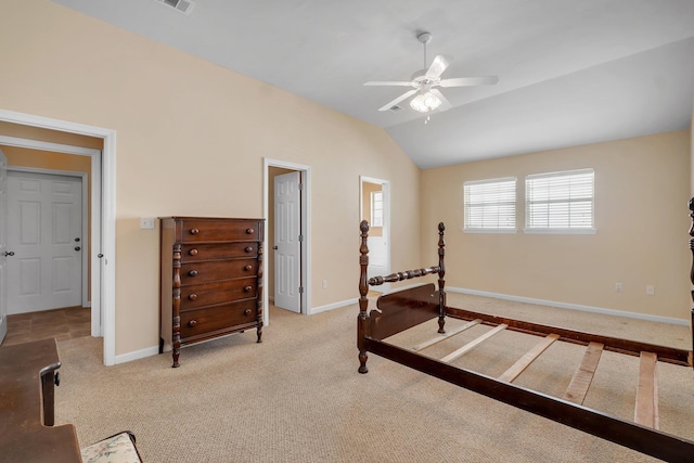 bedroom featuring lofted ceiling, light colored carpet, and ceiling fan