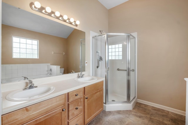 full bathroom featuring vanity, a wealth of natural light, toilet, and separate shower and tub