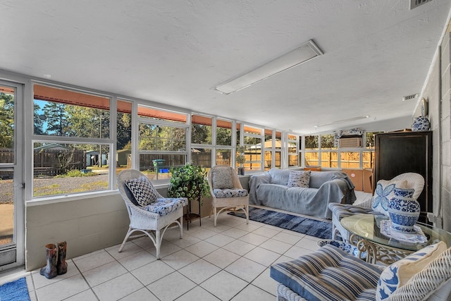 sunroom / solarium featuring lofted ceiling