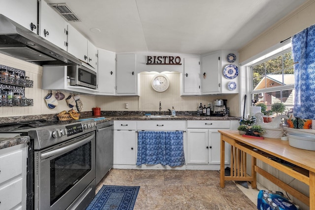 kitchen featuring white cabinets, sink, and appliances with stainless steel finishes