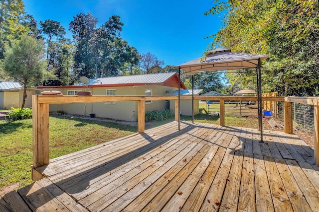 deck featuring a yard and a gazebo