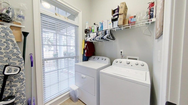 clothes washing area with washing machine and clothes dryer