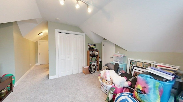 game room with light carpet, track lighting, and lofted ceiling