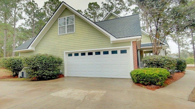 view of side of property with a garage