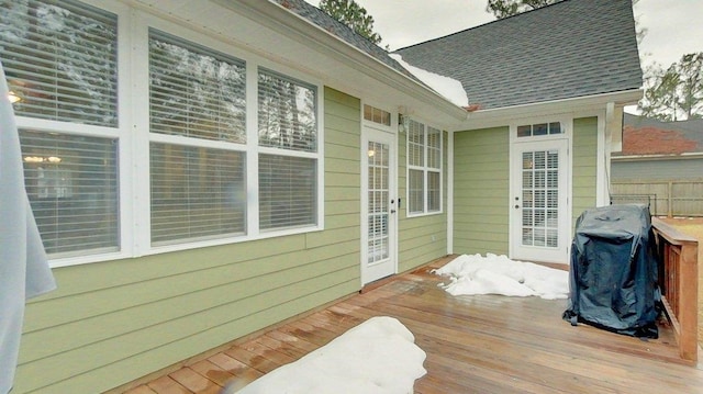 wooden terrace featuring a grill