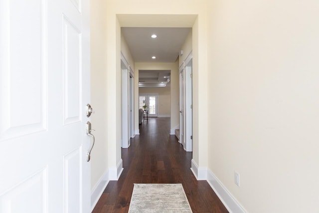 hall with dark hardwood / wood-style flooring