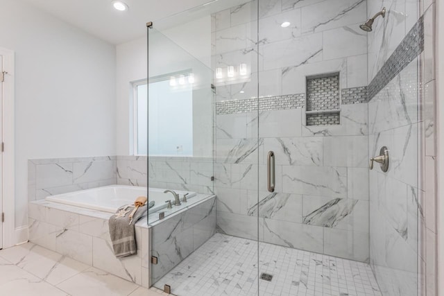 bathroom with separate shower and tub