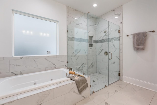 bathroom with separate shower and tub