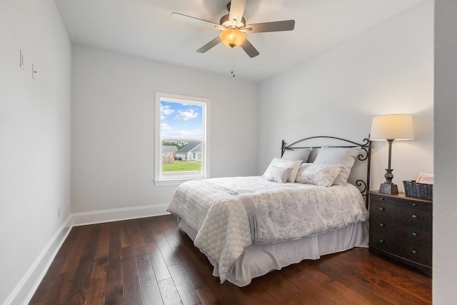 bedroom with dark wood-type flooring and ceiling fan