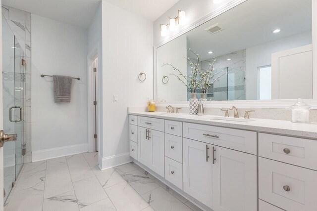 bathroom with an enclosed shower and vanity