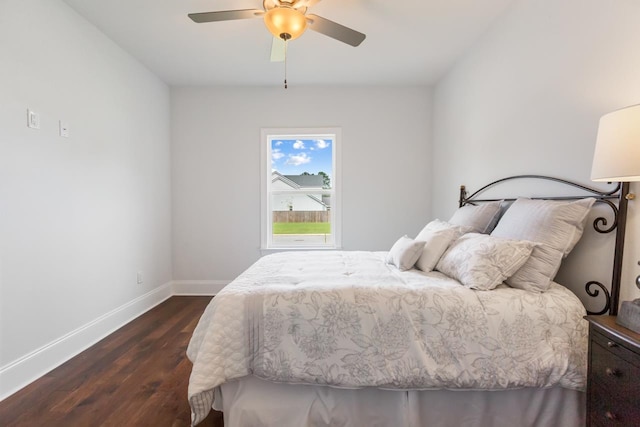 bedroom featuring dark hardwood / wood-style flooring and ceiling fan