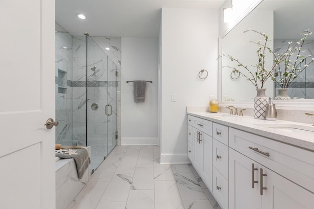 bathroom featuring vanity and a shower with door