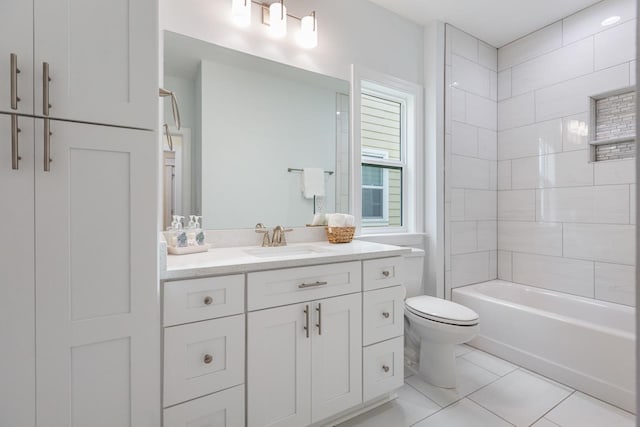 full bathroom with toilet, vanity, tiled shower / bath, and tile patterned flooring