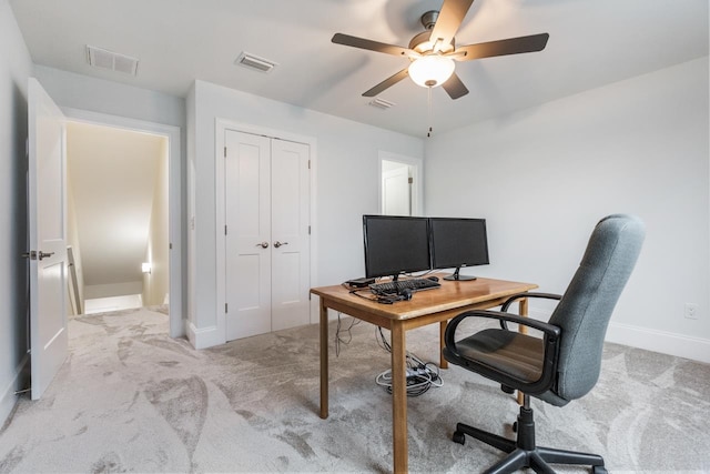 home office with light colored carpet and ceiling fan