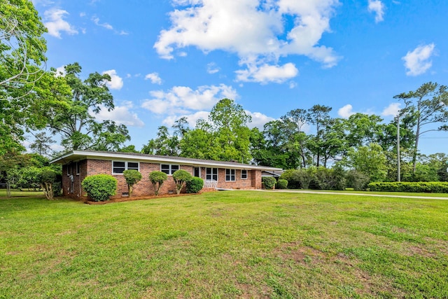 1106 Richardson Rd, Tallahassee, FL 32301 - view of front of property featuring a carport, a front yard, and brick siding