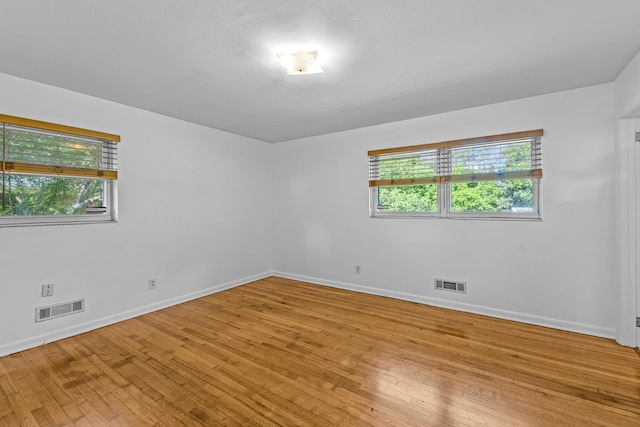 1106 Richardson Rd, Tallahassee, FL 32301 - empty room featuring visible vents, a healthy amount of sunlight, and light wood-style floors
