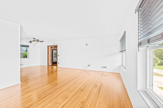 1106 Richardson Rd, Tallahassee, FL 32301 - unfurnished living room with light wood-style floors, baseboards, ceiling fan, and visible vents