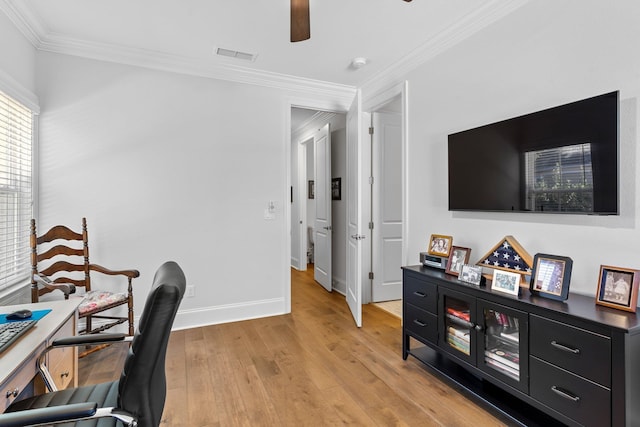 office featuring light wood-type flooring, ceiling fan, and ornamental molding