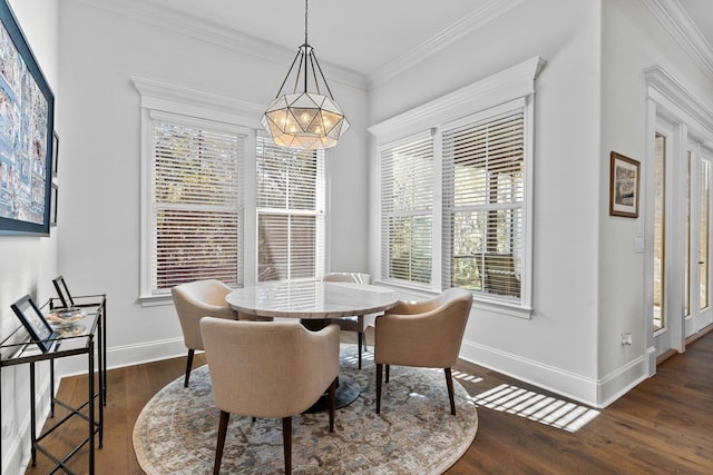 dining room with an inviting chandelier, crown molding, and dark wood-type flooring