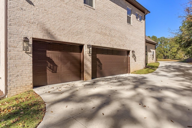 view of side of property featuring a garage