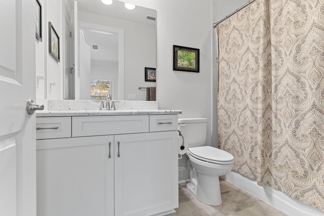 full bathroom featuring shower / tub combo, vanity, and toilet