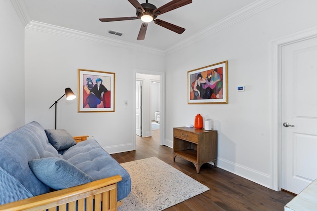 living room featuring crown molding, ceiling fan, and dark wood-type flooring