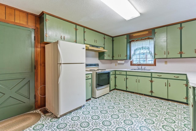 kitchen featuring white appliances, sink, and a textured ceiling