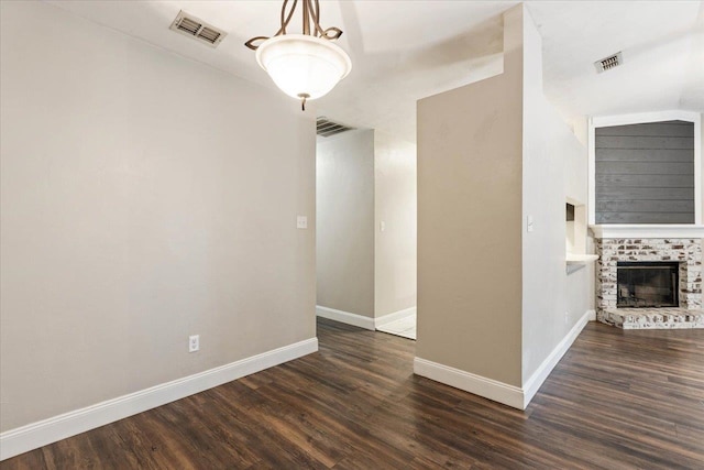 unfurnished room with dark hardwood / wood-style floors