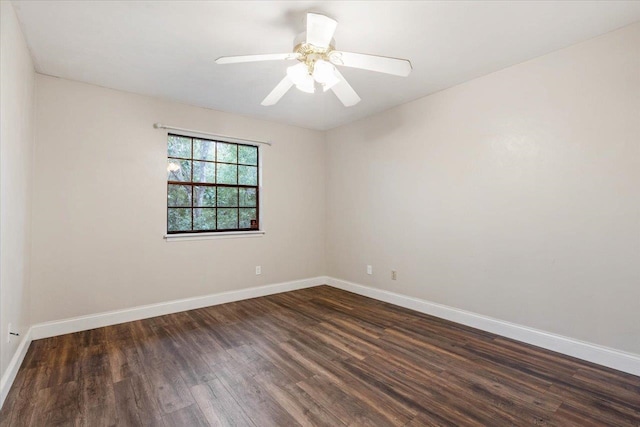 unfurnished room featuring dark hardwood / wood-style flooring and ceiling fan