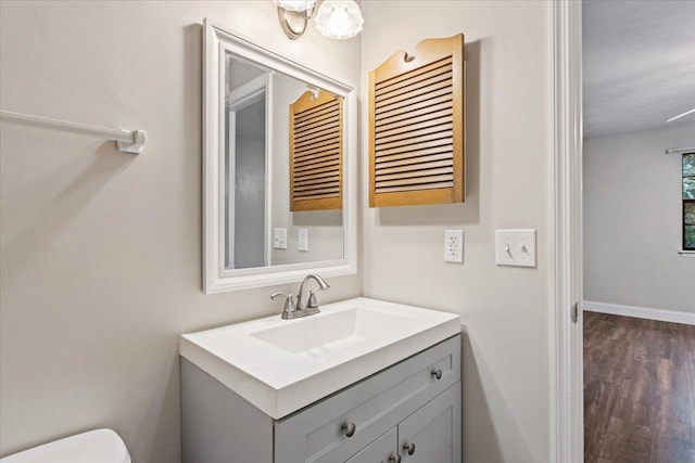 bathroom with hardwood / wood-style floors and vanity