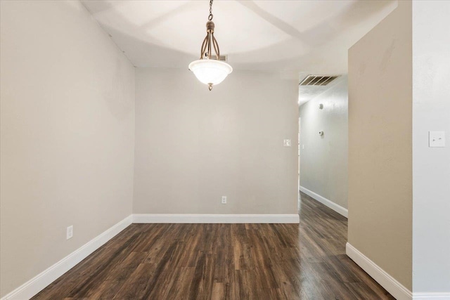 spare room featuring dark hardwood / wood-style floors