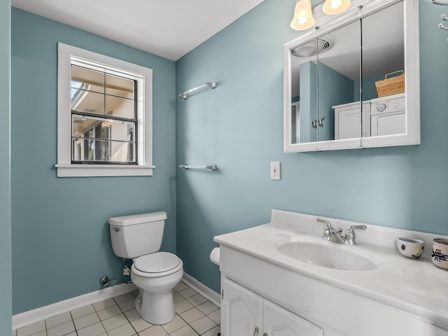 bathroom with visible vents, vanity, toilet, baseboards, and tile patterned floors