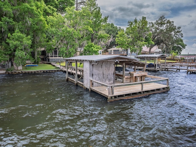 view of dock featuring a water view and boat lift