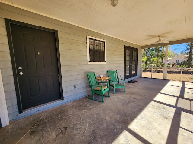 view of patio featuring ceiling fan and french doors