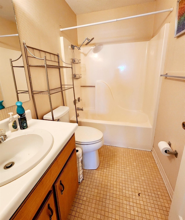 full bath with toilet, vanity, and shower / bathing tub combination