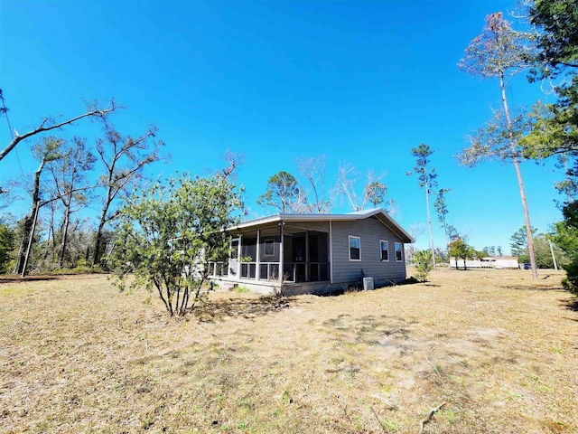 back of property featuring a sunroom