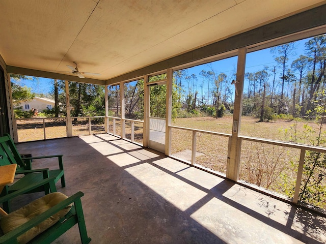 sunroom / solarium with ceiling fan