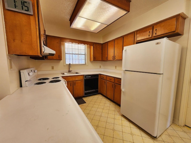 kitchen with brown cabinets, light countertops, a sink, ventilation hood, and white appliances