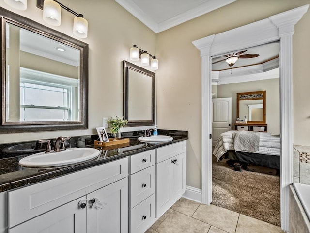 bathroom with vanity, ceiling fan, tile patterned flooring, and crown molding