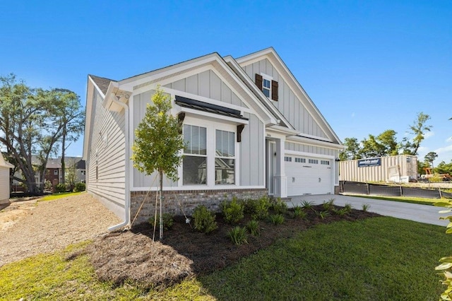 view of front of house with a garage and a front lawn