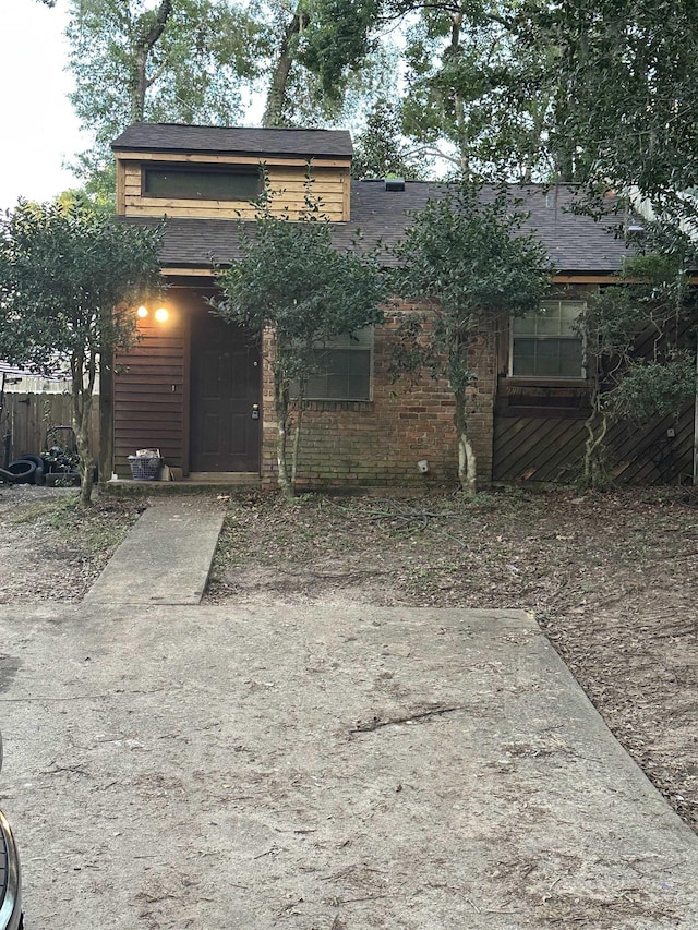 1063 Sutor Dr, Tallahassee, FL 32311 - view of front of house featuring a shingled roof and brick siding