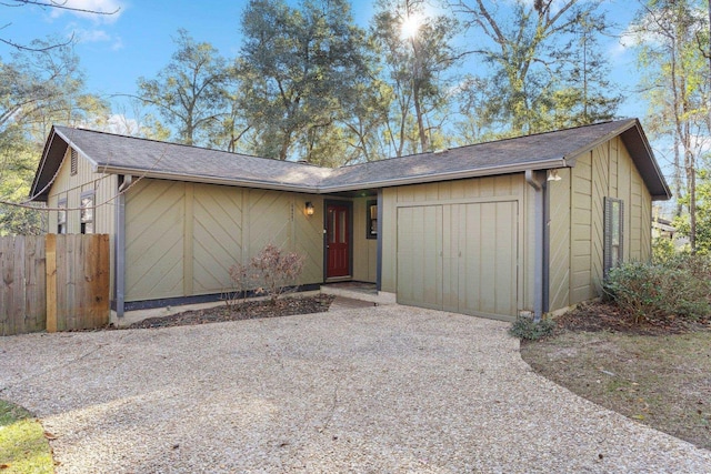 ranch-style home featuring a garage