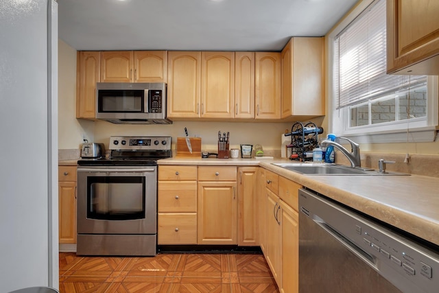 1625 Centerville Rd Unit 20, Tallahassee, FL 32308 - kitchen with appliances with stainless steel finishes, light brown cabinetry, and light countertops