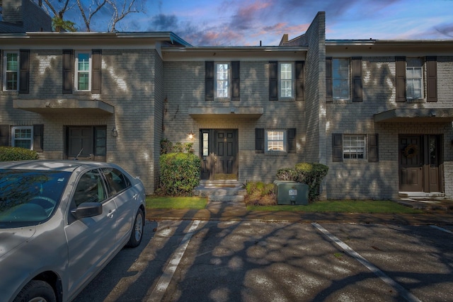 1625 Centerville Rd Unit 20, Tallahassee, FL 32308 - view of property featuring uncovered parking and brick siding