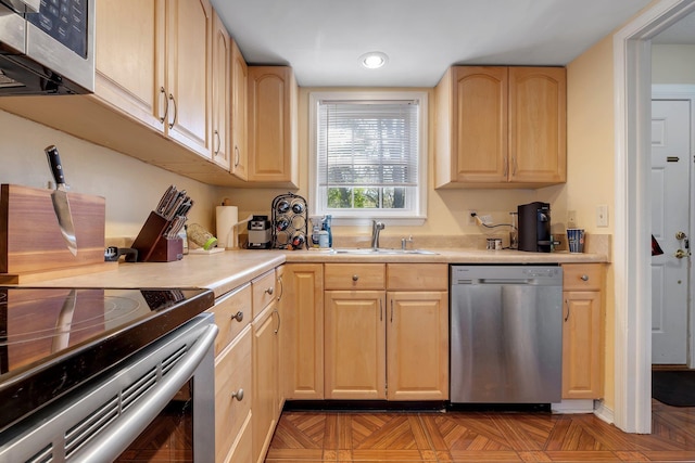 1625 Centerville Rd Unit 20, Tallahassee, FL 32308 - kitchen with appliances with stainless steel finishes, light brown cabinets, and light countertops