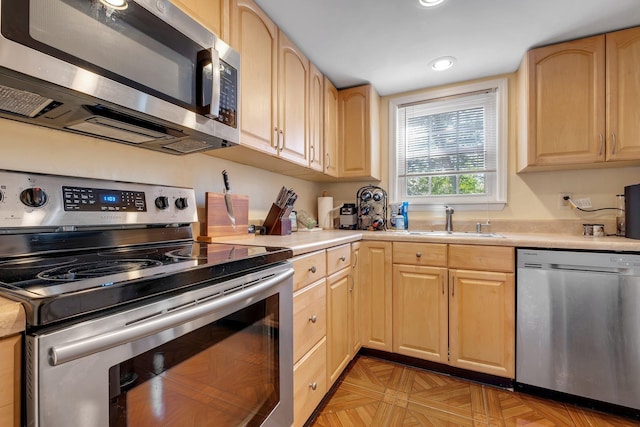 1625 Centerville Rd Unit 20, Tallahassee, FL 32308 - kitchen with stainless steel appliances, light brown cabinetry, light countertops, and recessed lighting